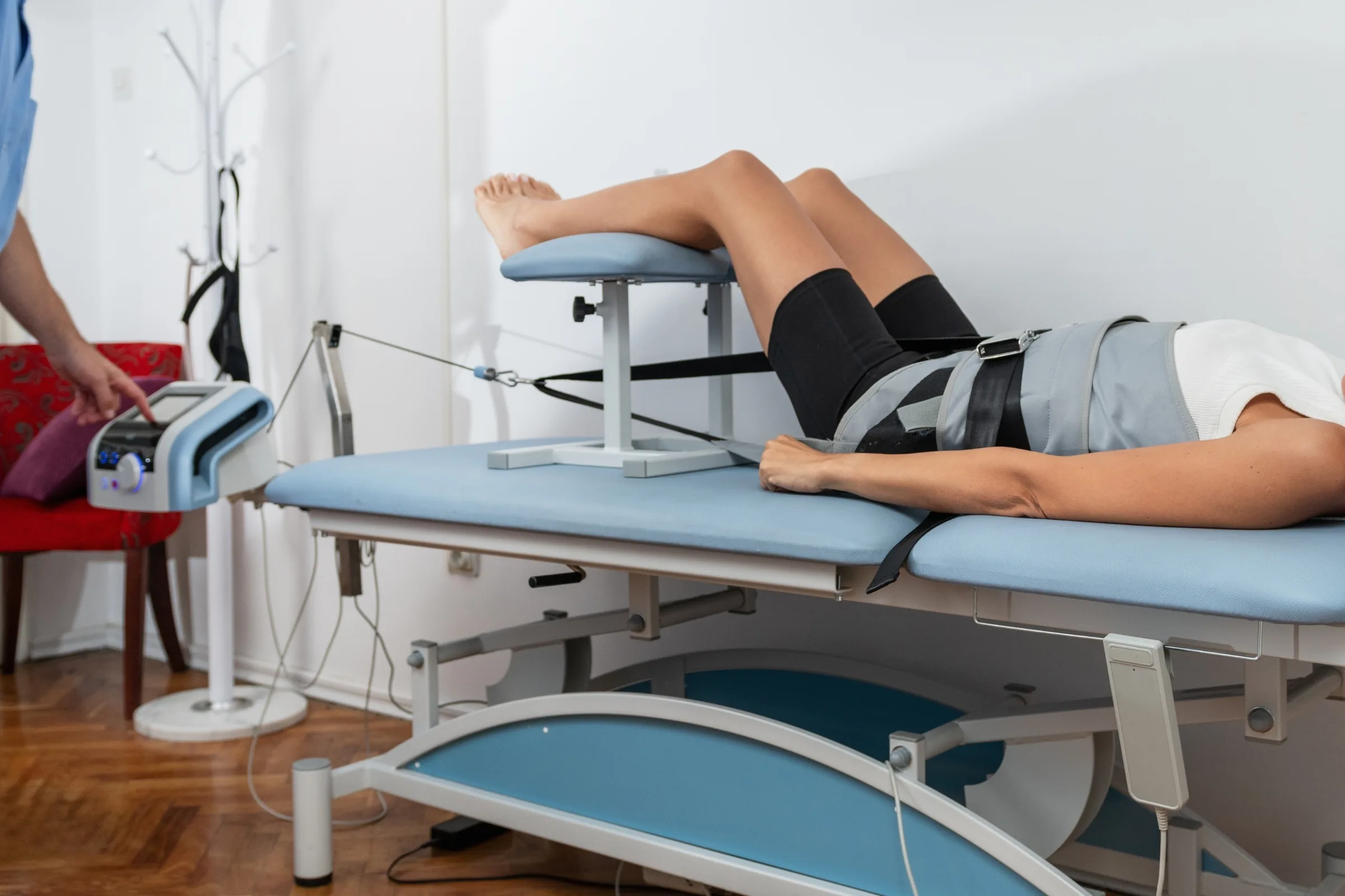 Patient receiving gentle non-surgical spinal decompression care Patient receiving gentle non-surgical spinal decompression care